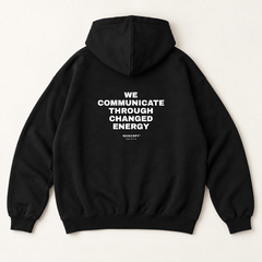 We communicate through changed energy hoodie — Black, back print