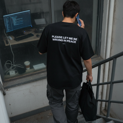 Please let me be wrong in peace t-shirt — Black, lifestyle photo